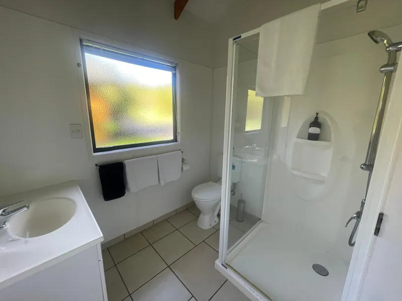 Bathroom with shower in Boutique Chalet, Kerigold Chalets Kerikeri