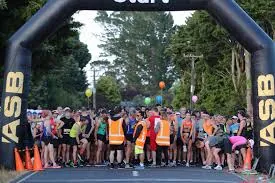 Kerikeri Half Marathon runners crossing the finish line at Kerikeri Domain