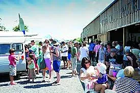 Popular café area at The Packhouse Market Kerikeri with customers enjoying locally-roasted coffee and gourmet food options